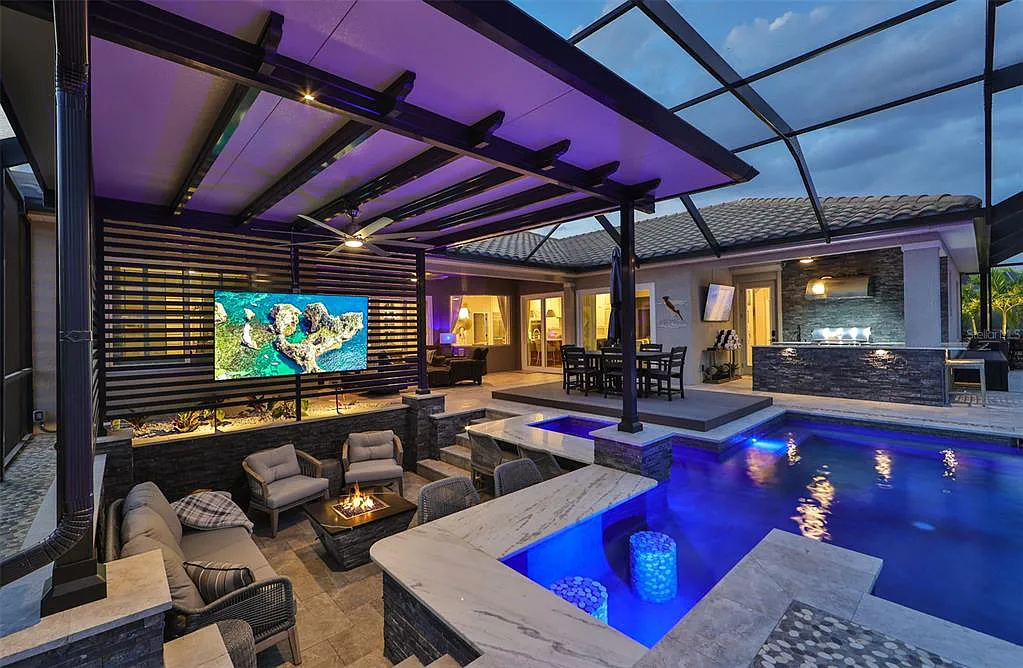 Custom Wahoo Pool with fire bowls and spa at dusk